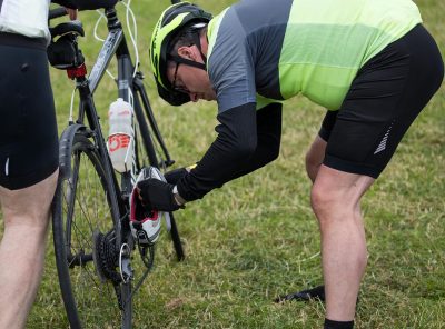 Man fixing bike before start of Tour de Burren
